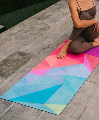 Woman doing yoga pose on Yoga Design Lab eco-friendly yoga mat